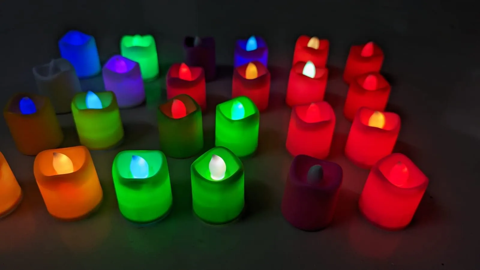 Dwarakesh Enterprises® pack of 24pcs Battery Powered designer Ambient Romantic Electric flameless multicolor Tealight Candles with flickering multi led flameless e-Led Candles for party, dinner, function, festivals(Multicolor, 4.7 * 3.7cm)