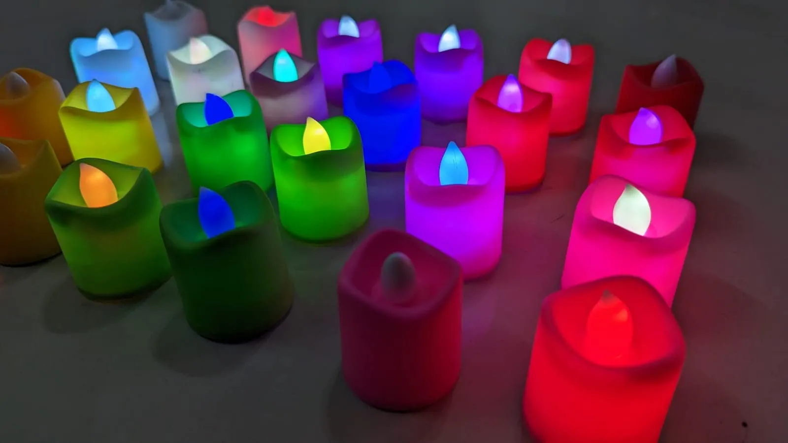 Dwarakesh Enterprises® pack of 24pcs Battery Powered designer Ambient Romantic Electric flameless multicolor Tealight Candles with flickering multi led flameless e-Led Candles for party, dinner, function, festivals(Multicolor, 4.7 * 3.7cm)