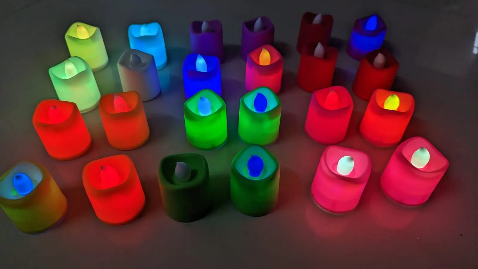 Dwarakesh Enterprises® pack of 24pcs Battery Powered designer Ambient Romantic Electric flameless multicolor Tealight Candles with flickering multi led flameless e-Led Candles for party, dinner, function, festivals(Multicolor, 4.7 * 3.7cm)